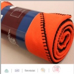 Rolled up promotional fleece blanket