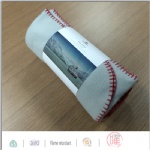 Rolled up solid color polar fleece blanket